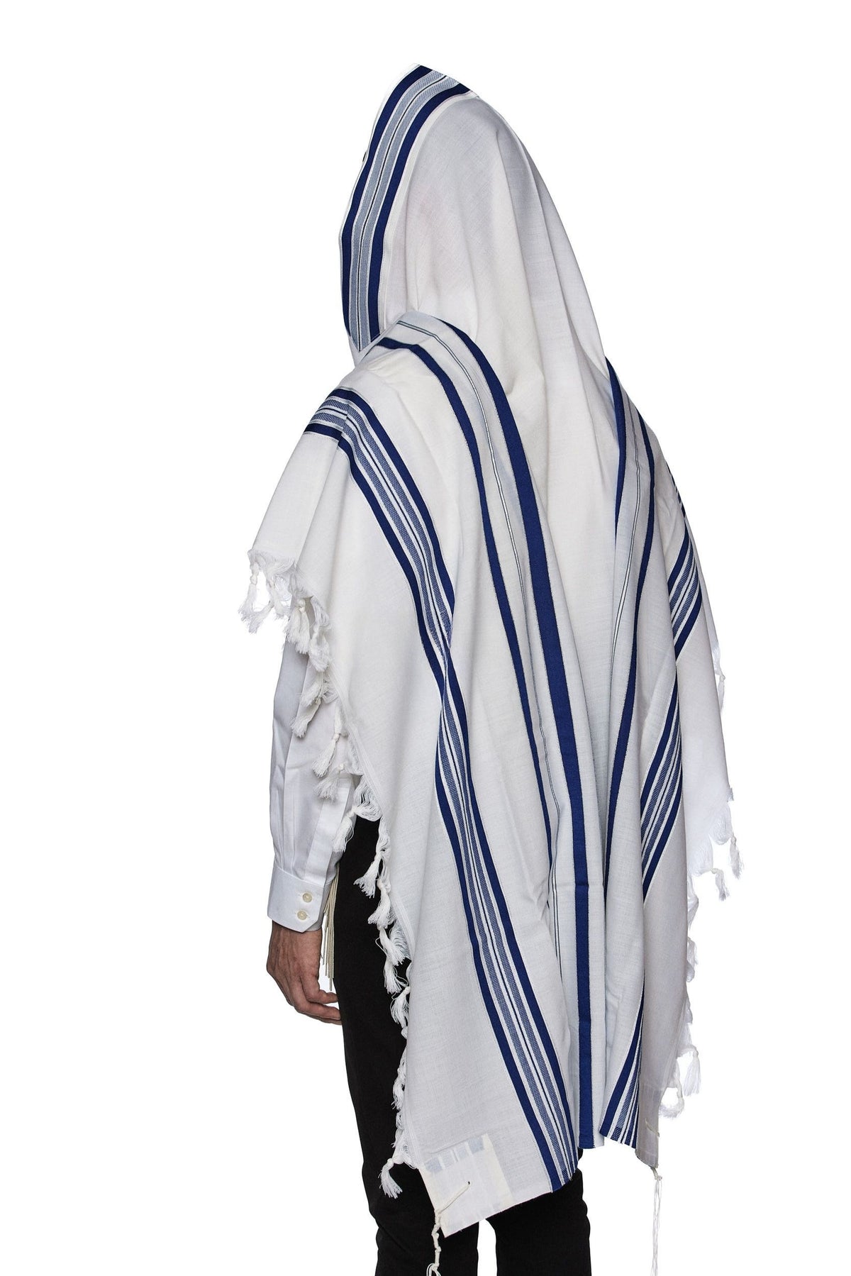 Man wearing Modim classic wool tallit with royal blue stripes